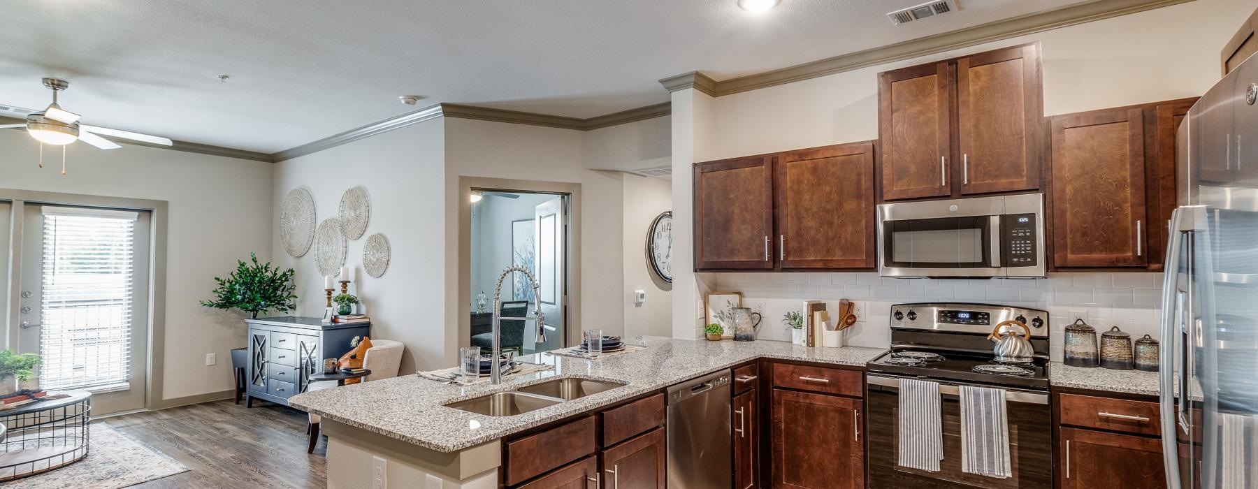 a kitchen with wooden cabinets