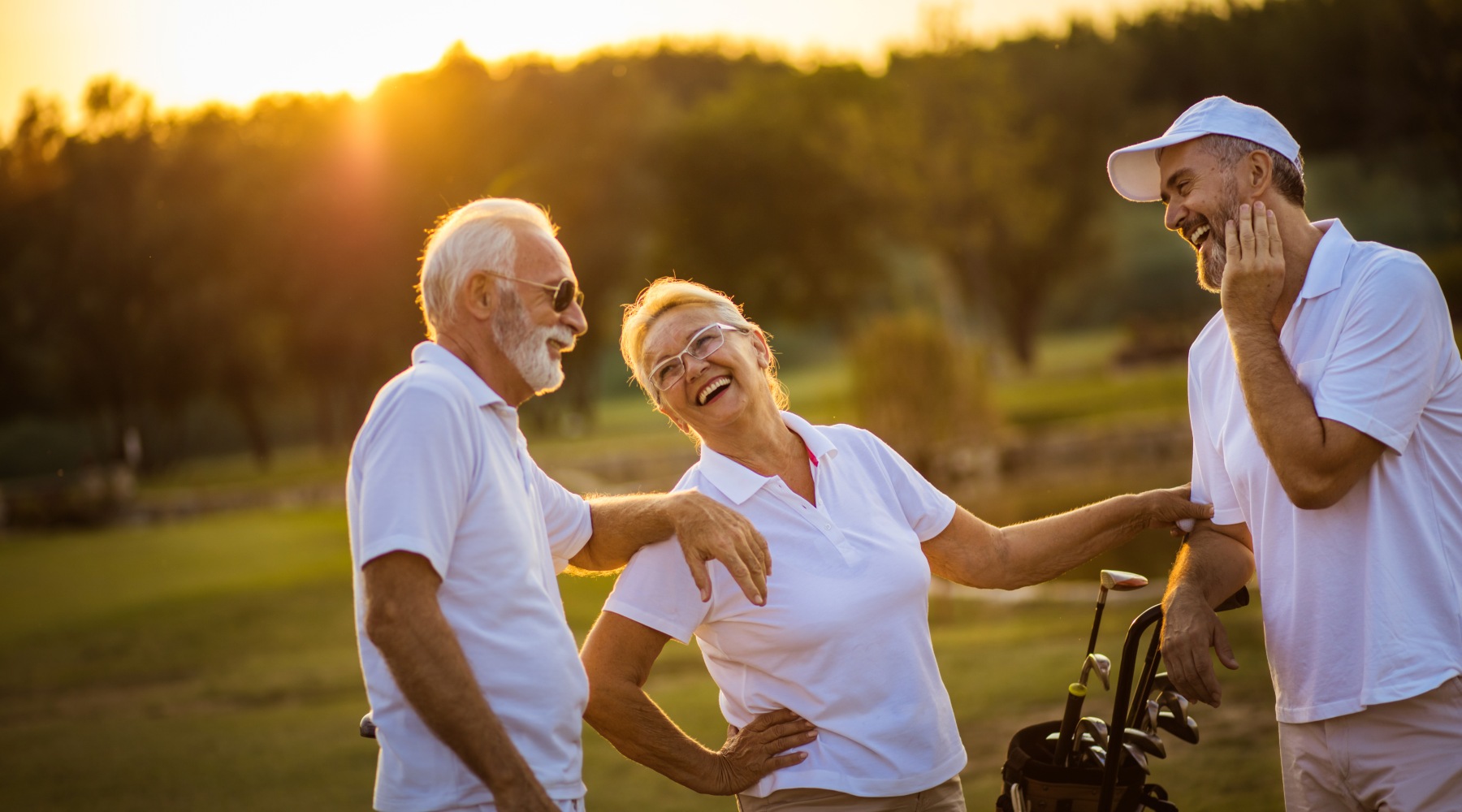 people laughing outside in the sunset
