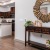 Open space living area with a creative nook and a mirror