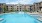 Resort-style swimming pool with lounge seating