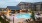 Resort-style swimming pool with lounge seating