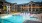 Resort-style swimming pool with lounge seating