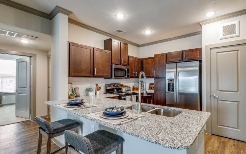 a kitchen with a marble island