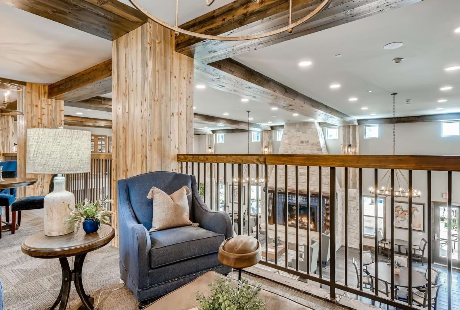 The resident lounge at Alders Prosper active adult living apartments in Prosper, TX, featuring a fireplace.